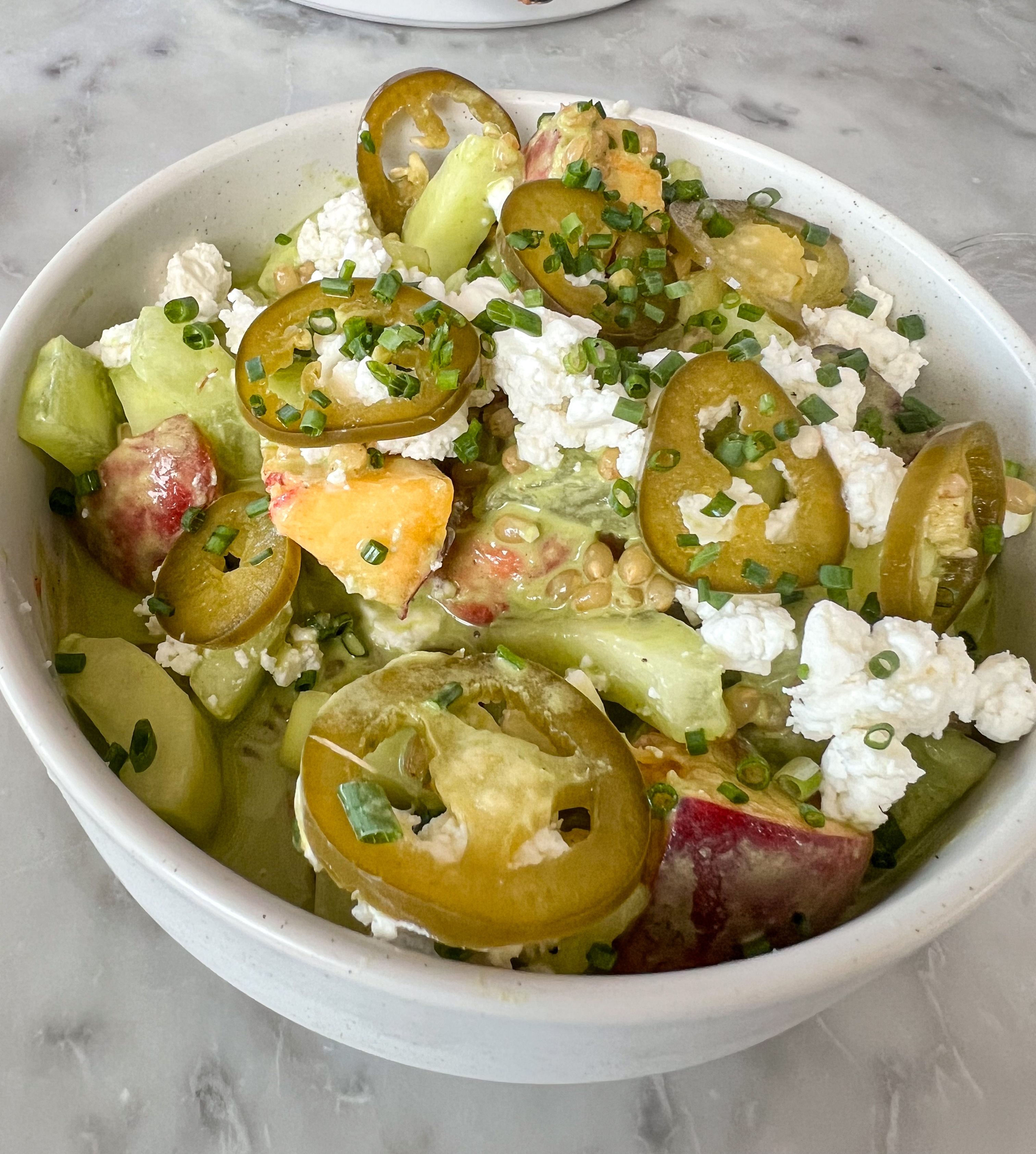 Refreshing salad with thinly sliced green jalapeños, diced cucumber, and crumbled white cheese with light dressing